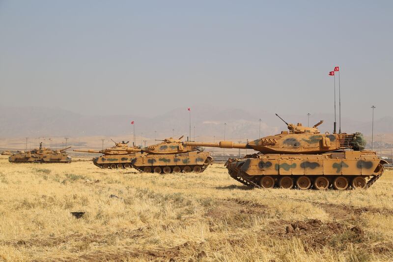 Turkish tanks are seen near the Habur crossing gate between Turkey and Iraq during a military drill on September 18, 2017.  
Turkey launched a military drill featuring tanks close to the Iraqi border the army said, a week before Iraq's Kurdish region will hold an independence referendum on September 25. / AFP PHOTO / STR