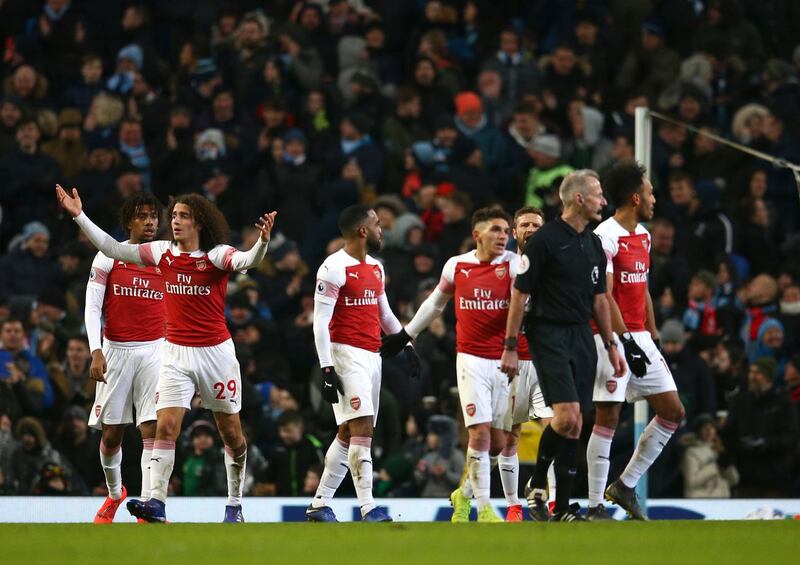 Arsenal players react after Aguero scored his side's third goal. AP Photo