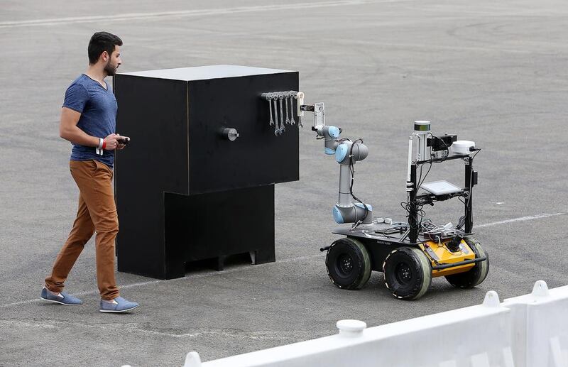 A member of the Mohammed Bin Rashid Space Centre team takes part in the Mohammed Bin Zayed International Robotics Challenge at Yas Marina Circuit in Abu Dhabi in 2017. A Dell survey warns that robots will fundamentally alter the nature of jobs in the future. Pawan Singh / The National