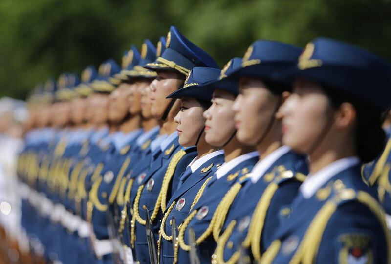 Female soldiers, as members of honour guards for the first time, stand in a line during a welcoming ceremony for Turkmenistan’s President Gurbanguly Berdimuhamedov outside the Great Hall of the People, in Beijing. Jason Lee / Reuters