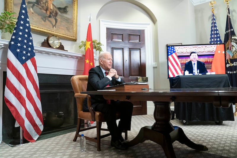Mr Biden speaks to Mr Xi, again virtually, from the Roosevelt Room of the White House last November. EPA