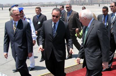 US Vice President Dick Cheney (R) is greeted by Egyptian Transportation Minister Mohammed Mansur (C) and other Egyptian officials upon his arrival to Cairo with his daughter Liz Cheney (not seen), 13 May 2007. Cheney continued his Middle East tour with a lightning stop in Egypt today for talks with President Hosni Mubarak on helping Iraq and curbing Iran's rising influence. Cheney went into talks with Mubarak, a close US ally, to seek help in drawing Iraq's minority Sunni Muslims into the country's fragile political process. The two men are also expected to discuss Shiite Iran's increasing power in the region, just as Iran announced it was ready to hold talks with the United Sates in a bid to improve security in Iraq. AFP PHOTO/OLIVIER KNOX (Photo by OLIVIER KNOX / AFP)