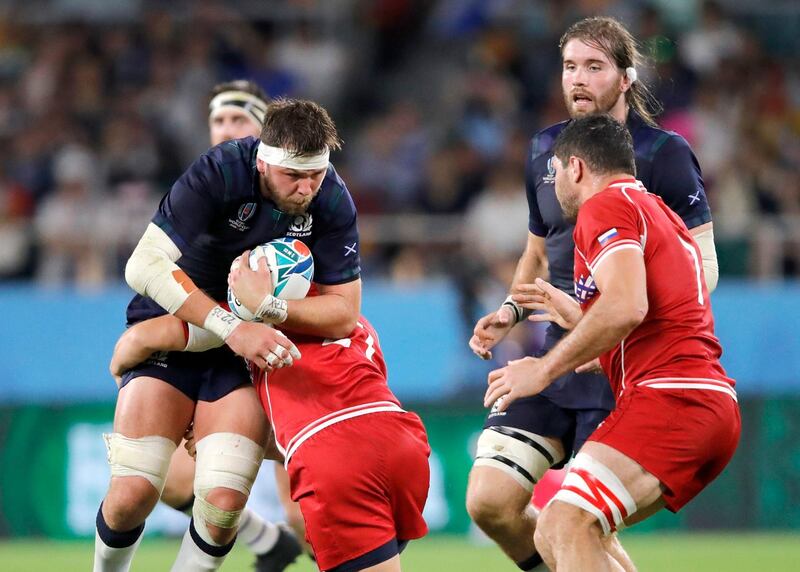 Scotland's Ryan Wilson runs at the Russian defence during the Rugby World Cup Pool A game at Shizuoka Stadium Ecopa between Scotland and Russia in Shizuoka, Japan. AP Photo