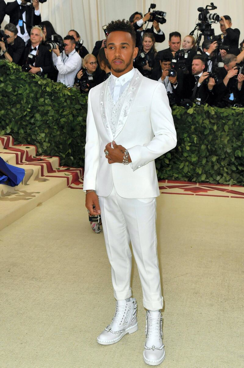 Lewis Hamilton arrives for the 2018 Met Gala on May 7, 2018, at the Metropolitan Museum of Art in New York. - The Gala raises money for the Metropolitan Museum of Art���s Costume Institute. The Gala's 2018 theme is ���Heavenly Bodies: Fashion and the Catholic Imagination.��� (Photo by Angela WEISS / AFP)
