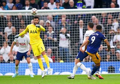 Callum Wilson, right, chips the ball over a stranded Hugo Lloris to give Newcastle the lead against Tottenham on October 23, 2022. PA