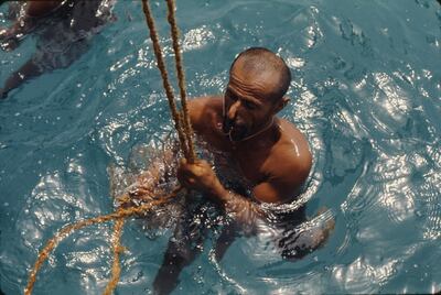 A pearl diver in the waters of the Arabian Gulf.  Photo: Alain Saint Hilaire