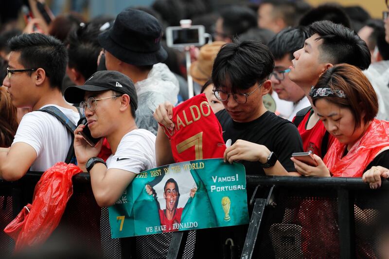 Fans react during the visit of Ronaldo. EPA