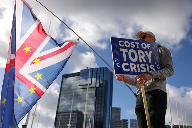 A protester demonstrates outside the annual autumn conference. Bloomberg