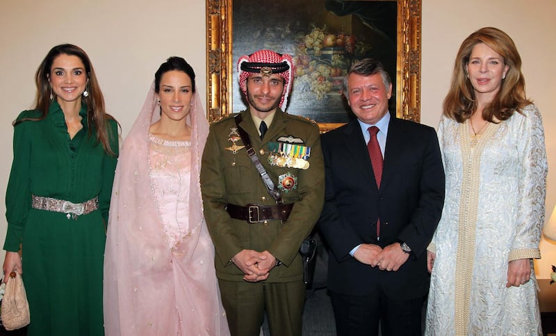 Jordan's King Abdullah; Queen Noor, widow of late King Hussein; and Queen Rania posing for a picture with Prince Hamzah, half-brother of Jordan's King Abdullah and his new wife Princess Basma Otoum in 2012. AFP, HO