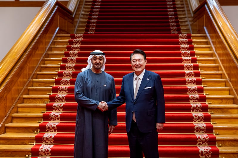Sheikh Mohamed and Mr Yoon stand for a photograph during a dinner reception at the Blue House. Ryan Carter / UAE Presidential Court 