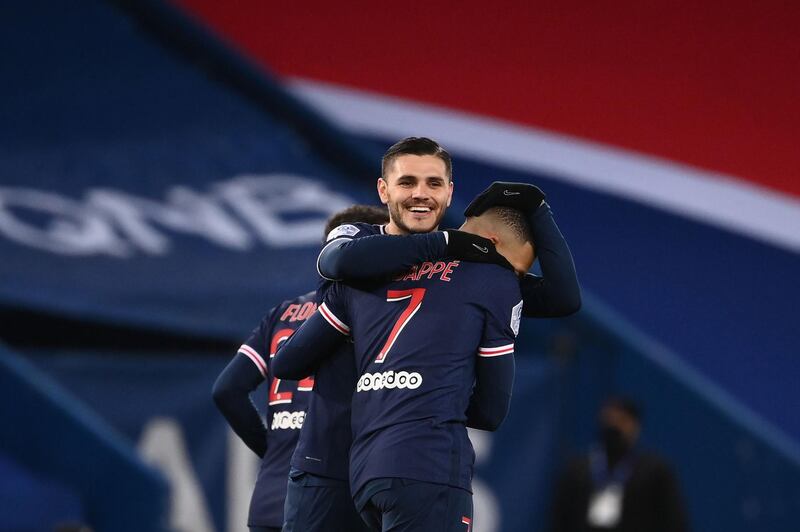 Paris Saint-Germain's French forward Kylian Mbappe celebrates with  Mauro Icardi after scoring his second goal. AFP