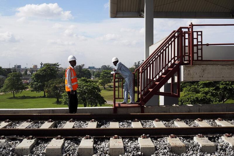 Engineers survey work at the National Arts Theatre stop of the light rail system under construction in Lagos by China Civil Engineering Construction Corporation. Joe Penney / Reuters