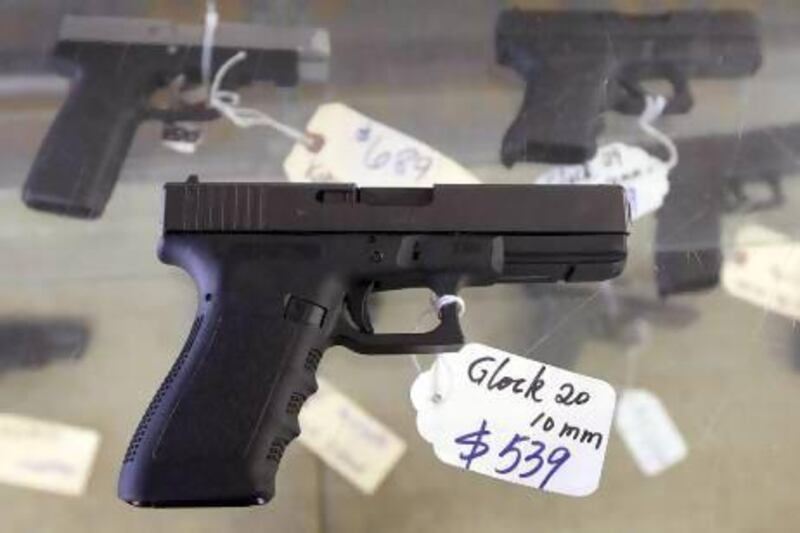 A Glock 20 10mm hand gun at the sales counter of the Guns-R-Us gun shop in Phoenix, Arizona.