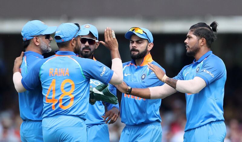 Cricket - England v India - Second One Day International - Lord’s Cricket Ground, London, Britain - July 14, 2018   India's Umesh Yadav celebrates with Virat Kohli and team mates after taking the wicket of England's Jos Buttler (not pictured)    Action Images via Reuters/Peter Cziborra