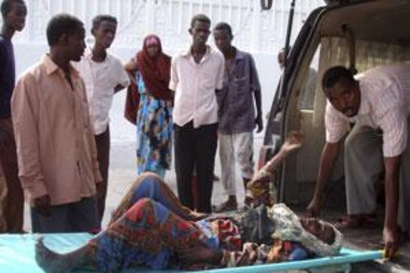 A wounded Somali woman is being carried on a stretcher in Mogadishu's Madina hospital.