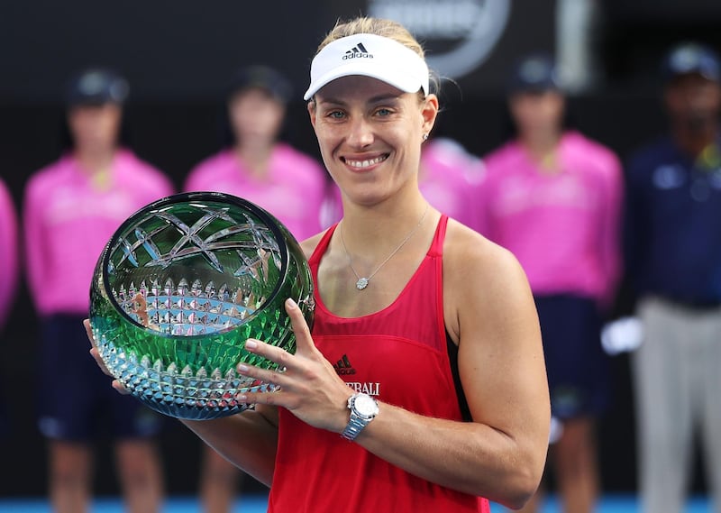 SYDNEY, AUSTRALIA - JANUARY 13:  Angelique Kerber of Germany poses with the winners trophy after the Women's Singles Final match against Ashleigh Barty of Australia during day seven of the 2018 Sydney International at Sydney Olympic Park Tennis Centre on January 13, 2018 in Sydney, Australia.  (Photo by Mark Metcalfe/Getty Images)