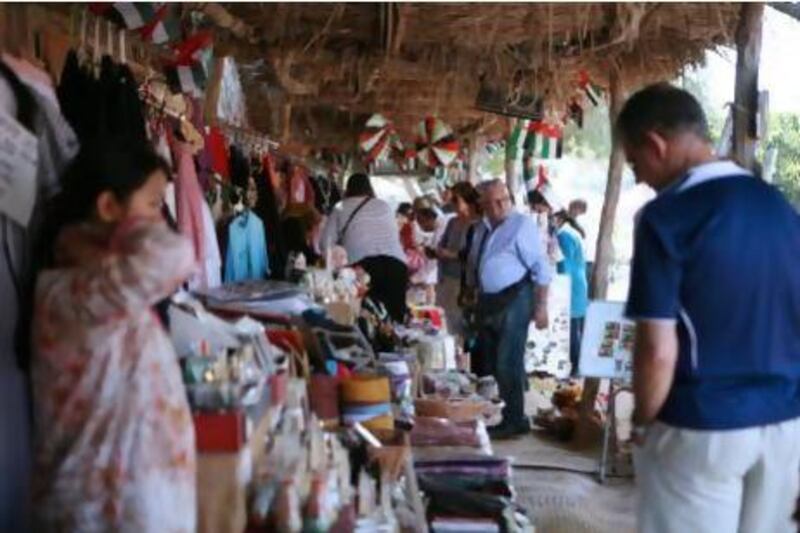 Tourists visit heritage village in Abu Dhabi. Over the next few years the capital will put the finishing touches to a host of landmark developments that are tipped to attract visitors keen to have a cultural experience. Fatima Al Marzouqi / The National