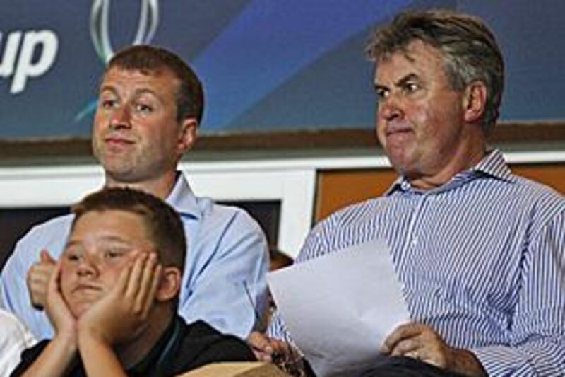 Hiddink, right, is good friends with Chelsea's Russian benefactor Roman Abramovich, left, and said he would be happy to help at Stamford Bridge.