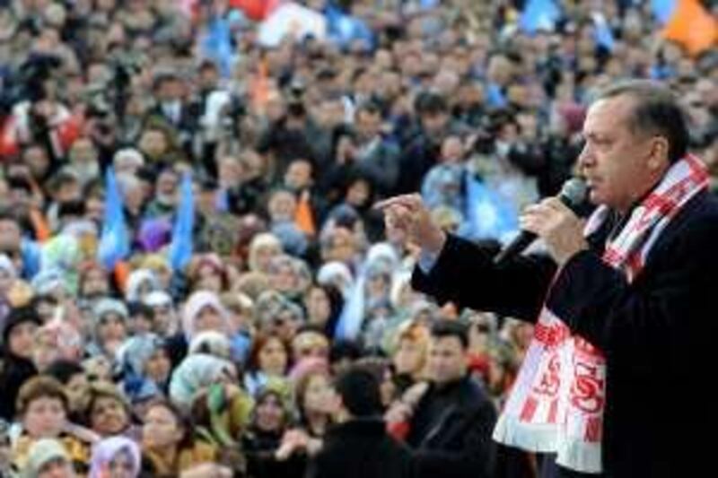 Turkey's Prime Minister Tayyip Erdogan delivers a speech as he campaigns ahead of the March 29 local elections in central Anatolian city of Sivas February 13, 2009. Turkey's government will resume talks with the opposition on drafting a new civilian constitution after March 29 local elections, Erdogan said on Friday.    REUTERS/Kayhan Ozer/Prime Minister's Press Office/Handout (TURKEY).  FOR EDITORIAL USE ONLY. NOT FOR SALE FOR MARKETING OR ADVERTISING CAMPAIGNS. *** Local Caption ***  ANK01_TURKEY-ERDOGA_0213_11.JPG