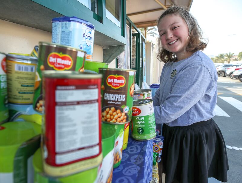 Marlee Mapstone, who is in the seventh year, takes part in the aid collection drive. Victor Besa / The National