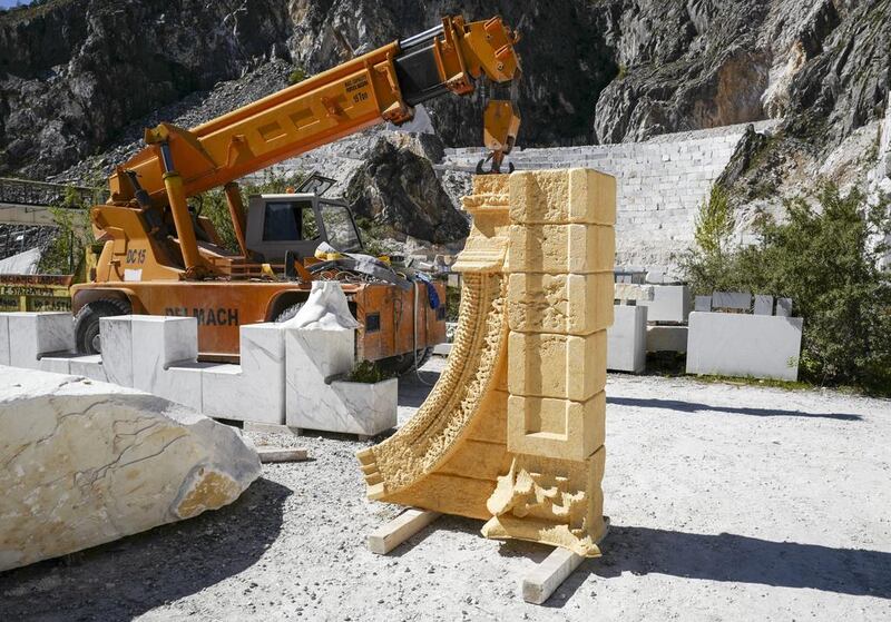 Workers construct the 3D marble replica Palmyra’s Arch of Triumph at the marble caves of Carrara, Italy. Marco Secchi / Getty Images