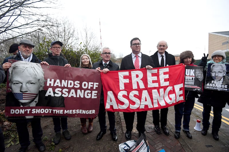 Australian MPs Andrew Wilkie, centre, and George Christensen, fourth right, with John Shipton, third right, the father of WikiLeaks founder Julian Assange, outside Belmarsh prison.