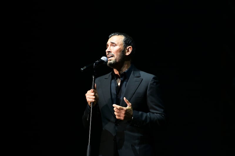 Kadim Al Sahir credits reading with helping him treat depression he often felt on stage. Khushnum Bhandari / The National