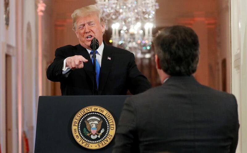 U.S.  President Donald Trump points at CNN's Jim Acosta and accuses him of "fake news" while taking questions during a news conference following Tuesday's midterm congressional elections at the White House in Washington, U.S., November 7, 2018. REUTERS/Kevin Lamarque     TPX IMAGES OF THE DAY