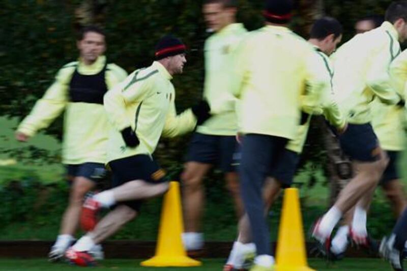 Wayne Rooney, second left, trains with the rest of the United squad yesterday, in preparation for the match against Bursaspor.