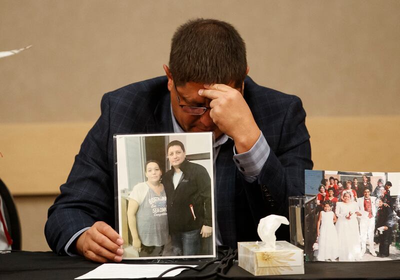 Mark Arcand, brother of James Smith Cree Nation stabbing victim Bonnie Burns, cries as he holds her picture at a news conference in Saskatoon, Saskatchewan. AFP