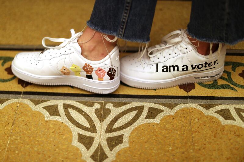 A woman lines up to vote at a polling station on Super Tuesday in Beverly Hills, California, U.S. REUTERS