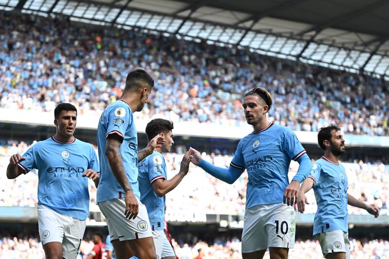 Manchester City's players celebrate their fourth goal. AFP