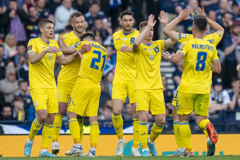 Ukraine'ss Andriy Yarmolenko (second left) celebrates after scoring his side's first goal. PA