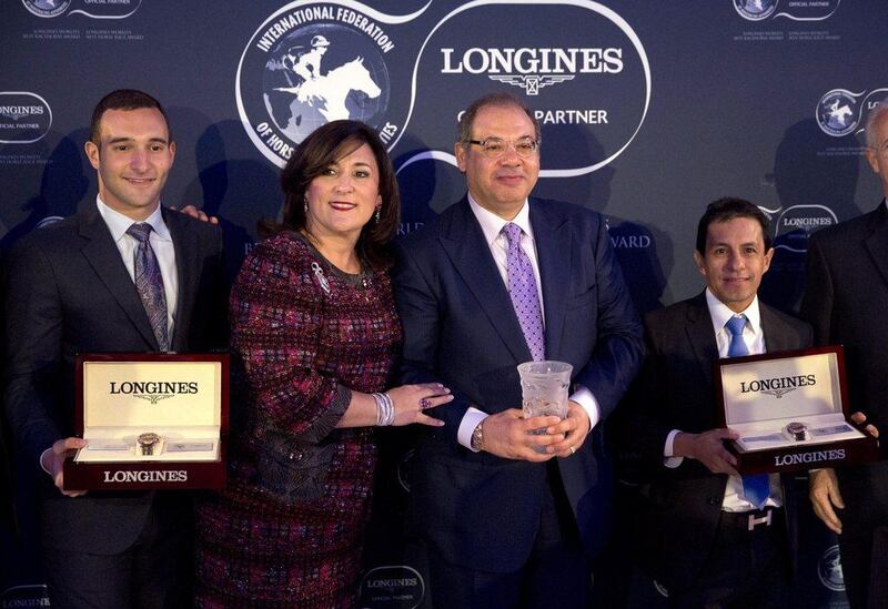 Ahmed Zayat, second right, the owner of the racehorse American Pharoah, his son Justin, left, wife Joanne and Mexican jockey Victor Espinoza pose for photographers after receiving their Longines World's Best Racehorse award for American Pharaoh's achievements in 2015 at an award ceremony at Claridge's hotel in London, Tuesday, Jan. 19, 2016. American Pharoah won the U.S. Triple Crown of Thoroughbred Racing in 2015, becoming the first horse to sweep the Kentucky Derby, Preakness Stakes and Belmont Stakes since 1978. Matt Dunham / AP Photo 