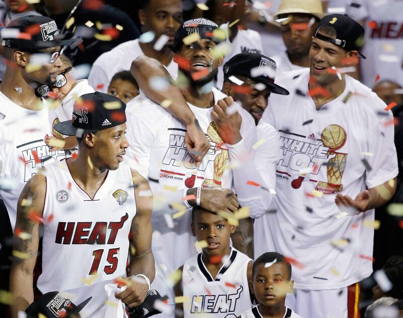 Miami Heat celebrate their second successive NBA title in front of home crowd but not before they were stretched to the distance by the Spurs. Wilfredo Lee / AP Photo