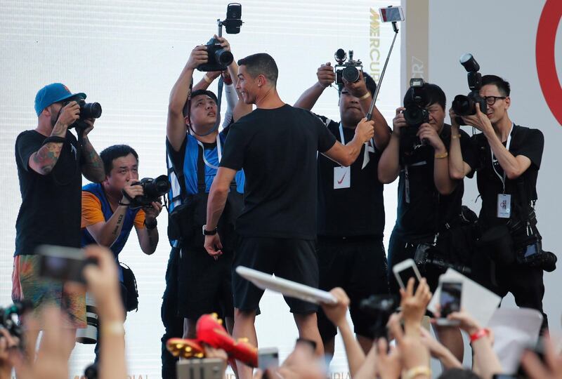 Ronaldo takes a selfie photo with fans. EPA