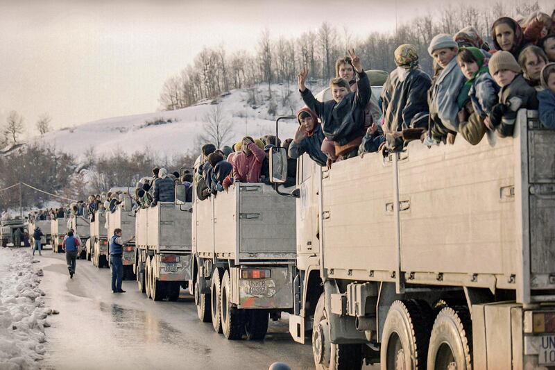 More than 2,000 evacuees from the besieged Muslim enclave of Srebrenica, packed on UN trucks en route to Tuzla, halt in Tojsici on March 29, 1993. AP Photo