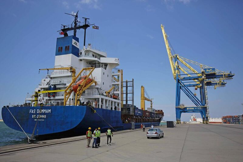 A cargo vessel moored next to a dock crane at Lebanon's Tripoli port. AFP