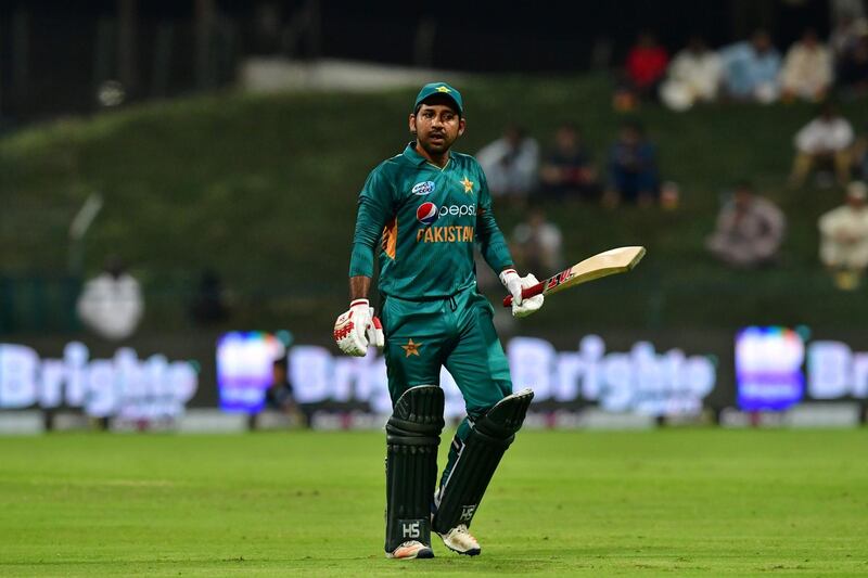 Pakistan cricketer Sarfraz Ahmed reacts as he walks back to the pavilion after his dismissal during the first T20 cricket match between Pakistan and New Zealand at The Abu Dhabi Cricket Stadium in Abu Dhabi on October 31, 2018.  / AFP / GIUSEPPE CACACE
