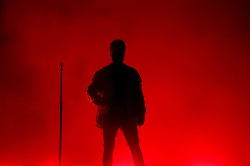 The Weeknd is silhouetted during the Yasalam After-Race concert at the Yas Island. AP