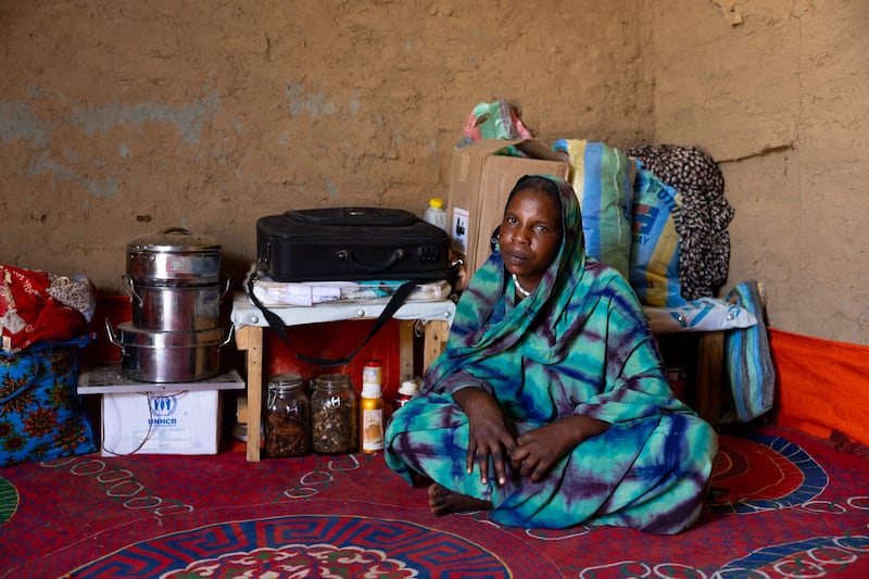 Twenty-six-year-old Sudanese refugee Hamra Adam Mohammed inside the shelter she built in the Farchana refugee camp