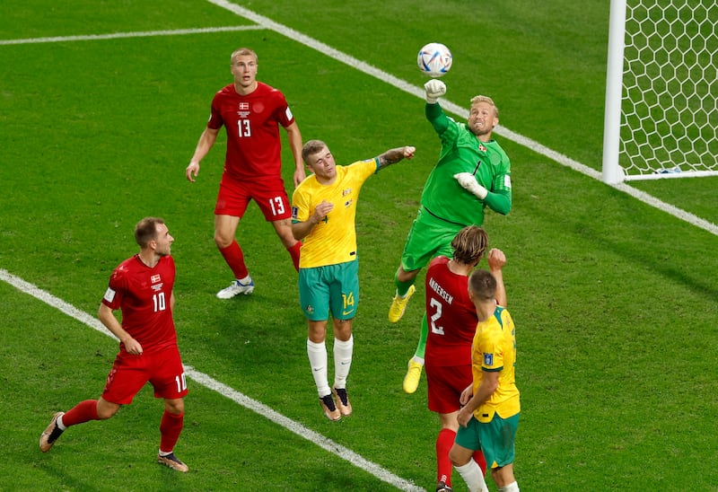 Denmark goalkeeper Kasper Schmeichel punches clear. Reuters