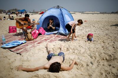 Israelis enjoy a day at the beach during parliamentary election day, in Zikim beach, southern Israel April 9, 2019. REUTERS/ Amir Cohen