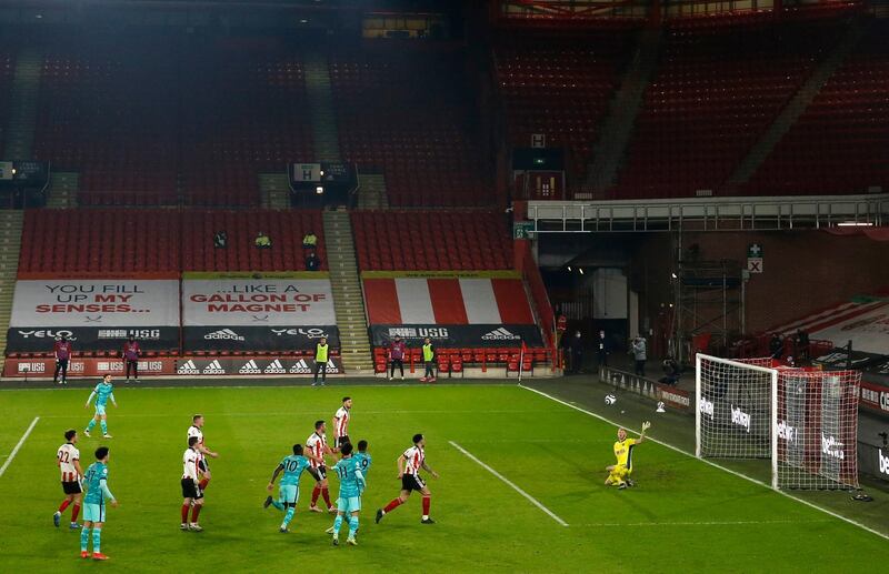 Roberto Firmino's defelcted effort heads towards the Sheffield United net to make it 2-0. PA