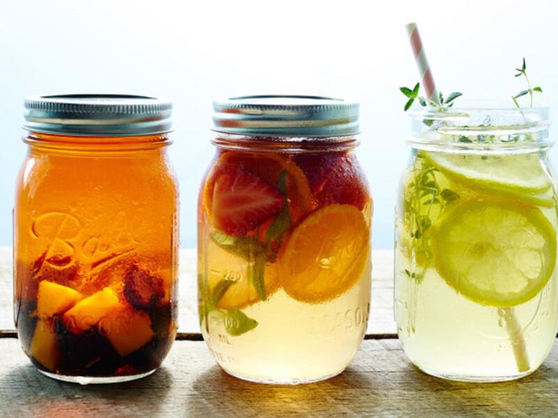 Iced tea, garnished with fresh fruit, is a refreshing drink for warmer days