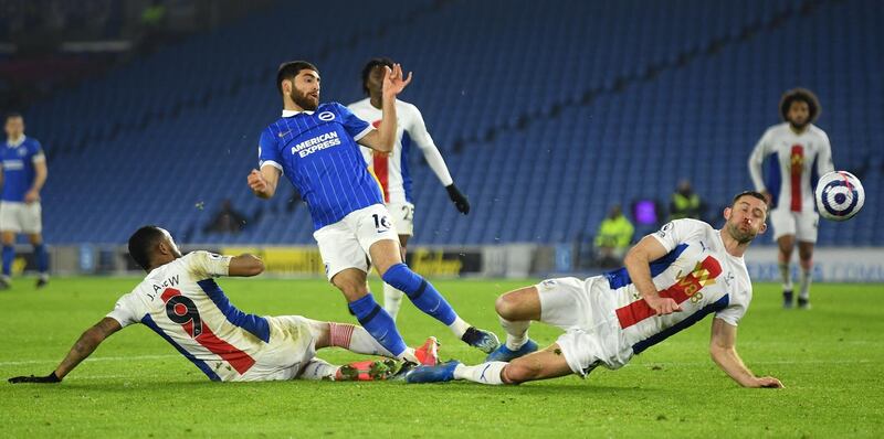Alireza Jahanbakhsh of Brighton in action against Gary Cahill and Jordan Ayew of Crystal Palace. EPA