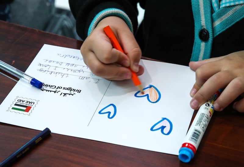 Alexandra Turunen, 7, writing letters of comfort