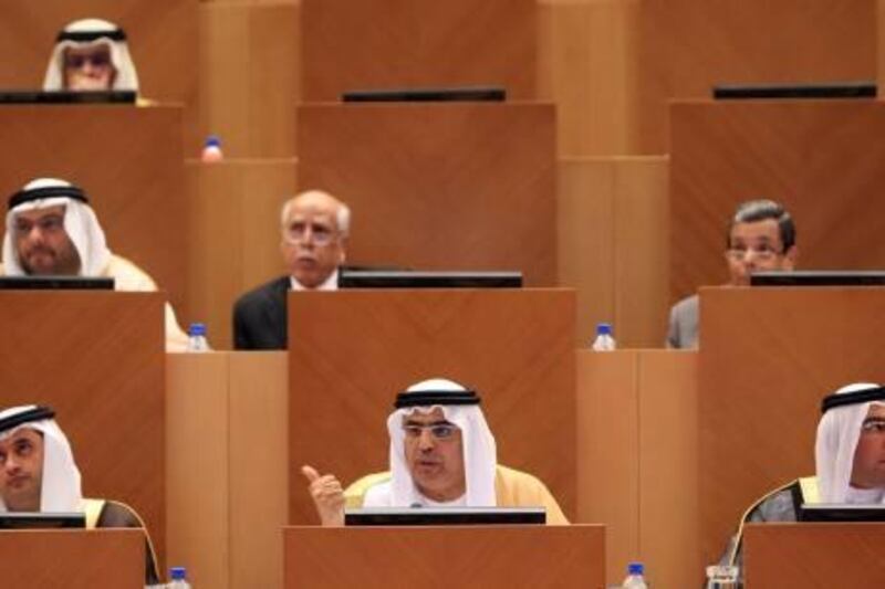 ABU DHABI - 28DEC2010 - Obaid Humaid al Tayer, centre, Minister of State for Financial Affairs speaks during an FNC session yesterday in Abu Dhabi. Ravindranath K / The National