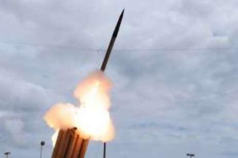 A handout photograph taken on Tuesday, March 17, 2009, shows the Terminal High Altitude Area Defense (THAAD) missile, used to intercept an incoming ballistic missile, being launched during a test at the Pacific Missile Range Facility off the island of Kauai in Hawaii, U.S., released to the media on Thursday, March 18, 2009. Kim Jong Il's government said on Feb. 24 it intended to send a communications satellite into orbit as part of a peaceful space project. South Korean officials have said they suspect North Korea may instead test a Taepodong-2 missile capable of reaching Alaska. Source: U.S. Missile Defense Agency via Bloomberg News
EDITOR'S NOTE: NO SALES. EDITORIAL USE ONLY.
