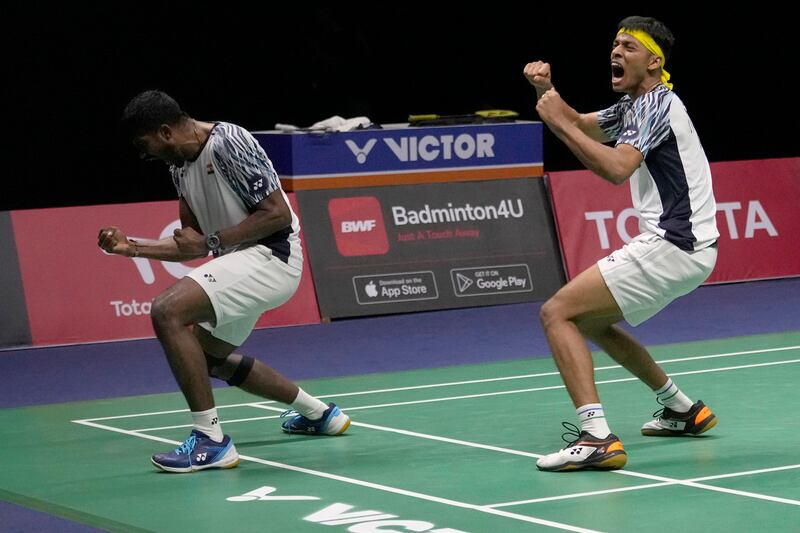 India's Satwiksairaj Rankireddy, left, and Chirag Shetty after defeating Indonesia's Kevin Sanjaya and Mohammad Ahsan during their men's double final of the Thomas Cup in Bangkok. AP
